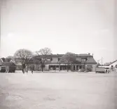 Boktryckare Davidssons fastighet, kv. Elden södra nr 6, Växjö.
Vy från nuv. Oxtorget mot nordväst.