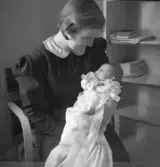 Kvinna med spädbarn