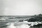Vy över hav, bebyggelse och klippor vid Torekov, Skåne 1922