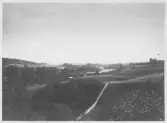 Dammen byggs 1897- Vy över Dalälven och ängsmark.