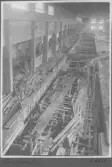 Kvarnsvedens pappersbruk, C 6553.  10-11-1930. Vy invändigt över bygget.