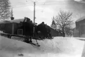 Barn åker kälke i snön i Nora, 1915