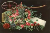 Gratulationskort med motiv av en vagn med blommor på framsidan. På baksidan adresserat till Ellen Sundberg.