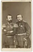 Porträtt på kung Carl XV och Fredrik VII av Danmark.