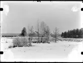 Gård i vinterlandskap
