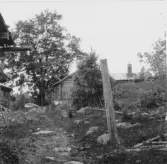 Bjursås, Falun. Älgberget. Fägata, fäbodstuga med konskorsten.

