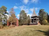 Idenors kyrka. Tiondemagasin och klockstapel