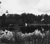 Gagnef. Kyrkan och älven. t.h.

