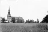 Mora, Mora strand. Mora kyrka och klockstapeln.

