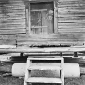 Mora. Selja. Enebygården. Härbredörr med 1765.

