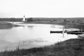 Malung. Tällbyn. Vik av älven och kyrkan från Tällbyn.

