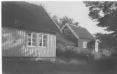 Två bostadhus, Stocken, Släp socken.