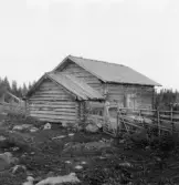 Gagnef. Stuga med bod tillbygd vid mjölkkammargaveln Jánsolles buan. 1920.