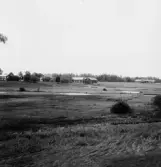 By, Näckenbäck. Tunnvälvd bro över bäcken. 1931.